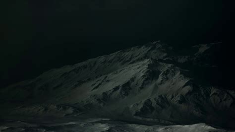 Dramatic Dark Rocky Mountain With Patches Of Stock Motion Graphics Sbv