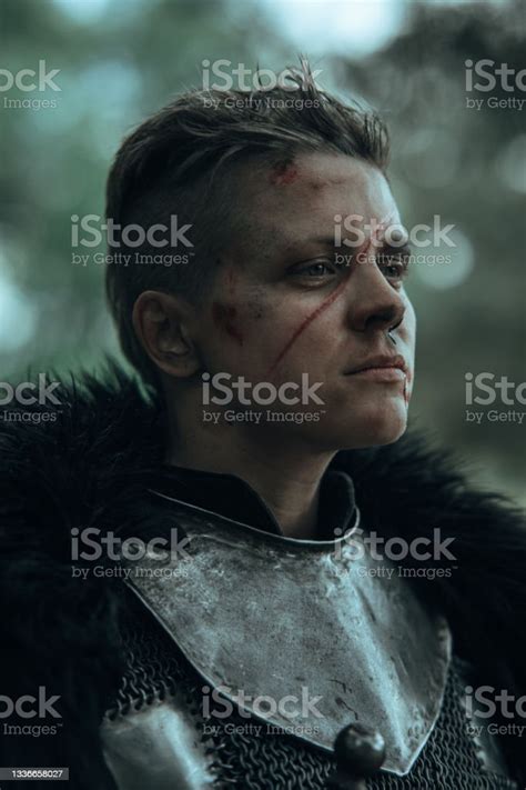 Portrait Of Medieval Knight In Chain Mail Armour With Face Scar Stock