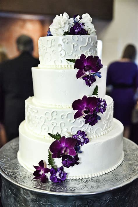 White And Purple Wedding Cake With Cascading Purple Flowers Copyright