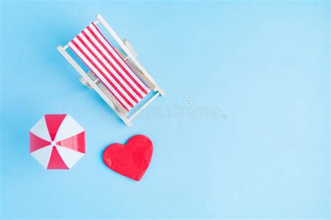 Deck Chair With Umbrella And Heart On Blue Background Flat Lay Summer