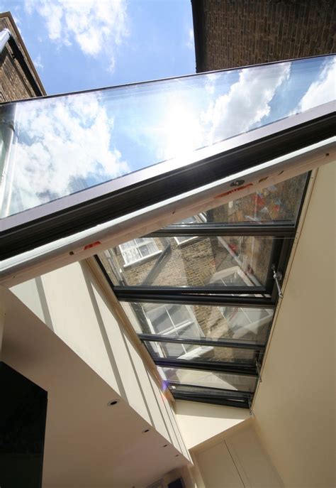 By Combining A Multi Panel Hinged Glass Roof With Other Installations