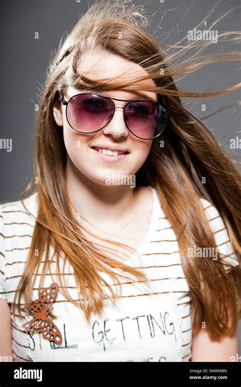 Pretty Brunette Teenage Girl With Sunglasses Studio Shot Stock Photo