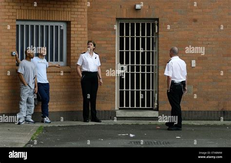Prison Officers And Prisoners In The Exercise Yard Of Hmp Woodhill