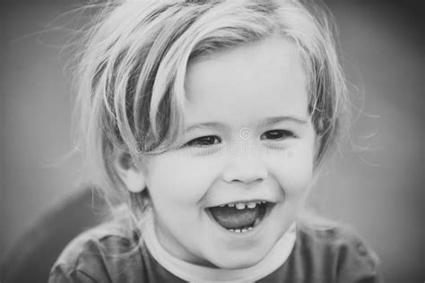 Happy Kid Having Fun Baby Boy With Blond Hair Smile On Cute Face