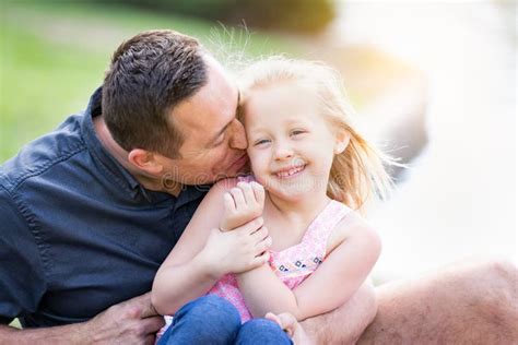 Young Caucasian Father And Daughter Cuddling At The Park Stock Image Image Of Playing