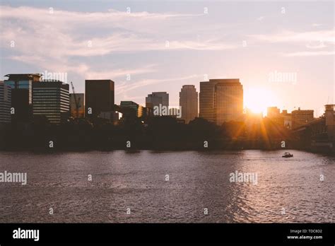 Beautiful Sunrise Over An Urban City With A Lake Stock Photo Alamy