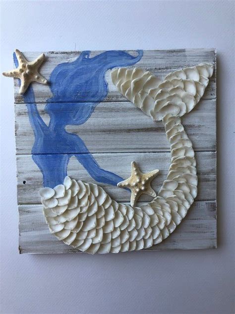 A Piece Of Art Made Out Of Wood With Shells And Starfishs On It