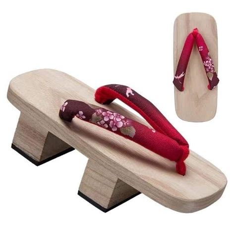 these traditional japanese sandals feature the strap with red cherry blossom and dragon fly