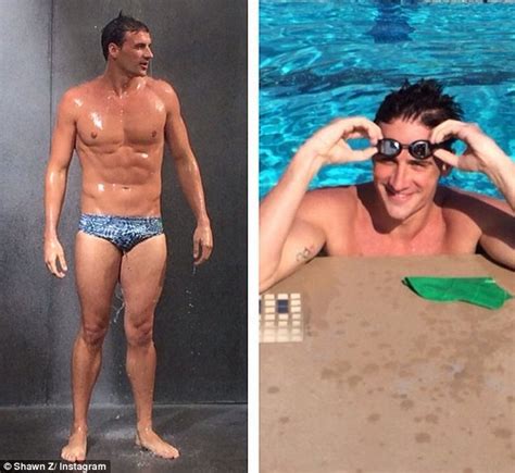 ryan lochte displays his impressive six pack as he poses in just a tiny pair of speedos daily