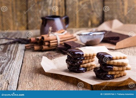 Handmade Chocolate Dipped Cookies And Melted Dark Chocolate Stock Photo