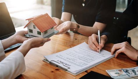 Real Estate Agent Offer Hand For Customer Sign Agreement Contract Signature For Buy Or Sell