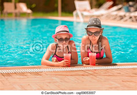 Happy Girls At The Pool Having Great Time Enjoying Drinks Canstock