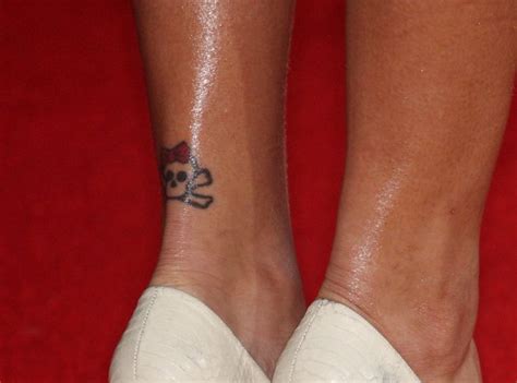 A Guide To Rihannas Tattoos Her 25 Inkings And What They Mean