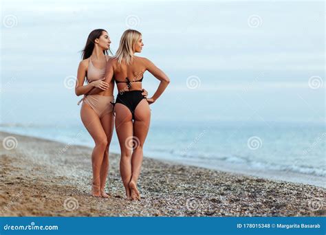 Two Amazing Tanned Girls On The Beach Stock Photo Image Of Caucasian
