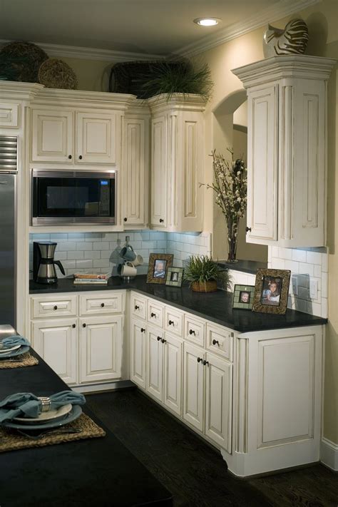 The cabinet are made out of french white oak and the stain was custom from the manufacturer, crown point cabinetry, in new hampshire. Pin by Newline Design Center on Kitchens | Dark kitchen ...