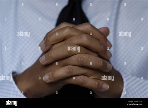 A Persons Folded Hands Stock Photo Alamy