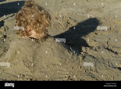 Little Girl Buried In Sand At The Beach Prophete Marseille France