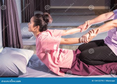 Thai Massage Therapist Is Massaging A Woman Arm In Spa Stock Image