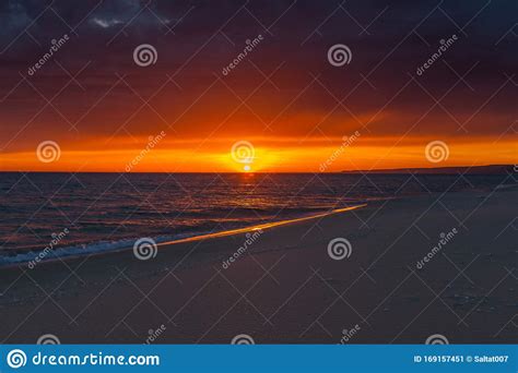 Stormy Sunset Over The Caspian Sea Coast. Background Of A Beautiful Orange-red Sunset On The ...