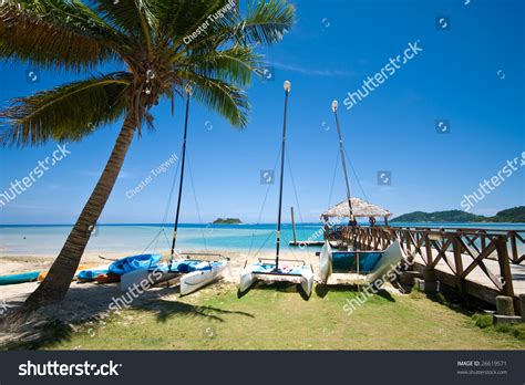 Tropical Beach And Pier Water Activities Stock Photo
