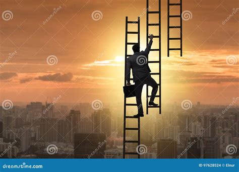 The Businessman Climbing Career Ladder In Business Concept Stock Photo