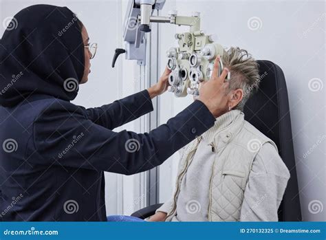 Eye Exam Healthcare And Senior Woman With Optometrist In Clinic For