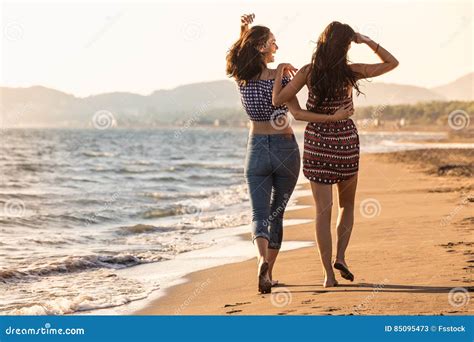 Pretty Girl Has A Fun With Her Girlfriend On The Beach Stock Image