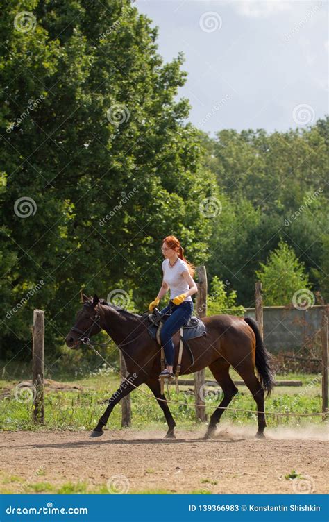 A Redhead Woman Riding A Horse On A Leash Stock Image Image Of