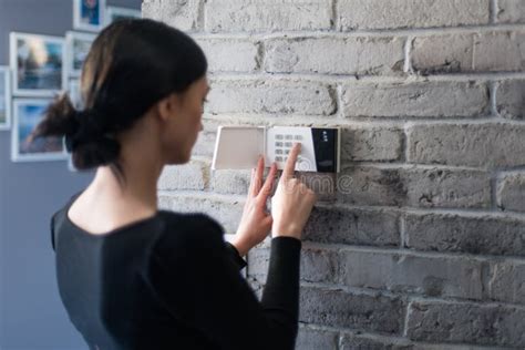 Young Woman Entering Security Pin On Home Alarm Keypad Stock Image Image Of Safe Alarm 135373107