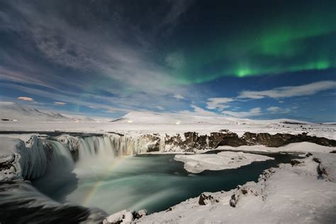 Lunar Rainbow Over Godafoss Waterfall In North Iceland With The