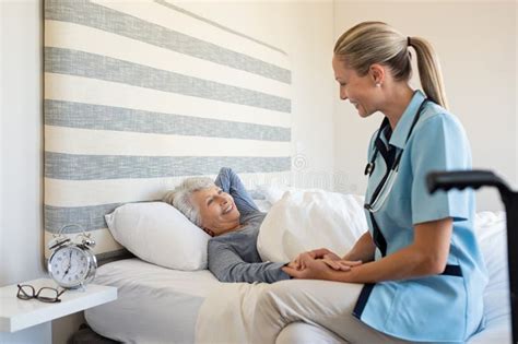Nurse Checking Senior Woman At Home Stock Image Image Of Assistance
