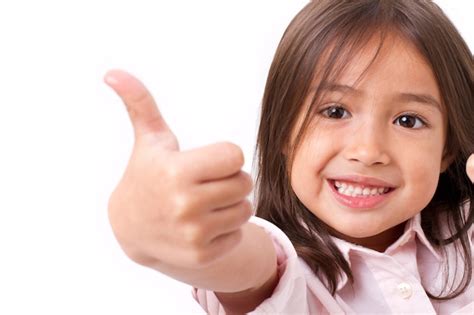 Premium Photo Happy Smiling Young Little Girl Giving Thumb Up