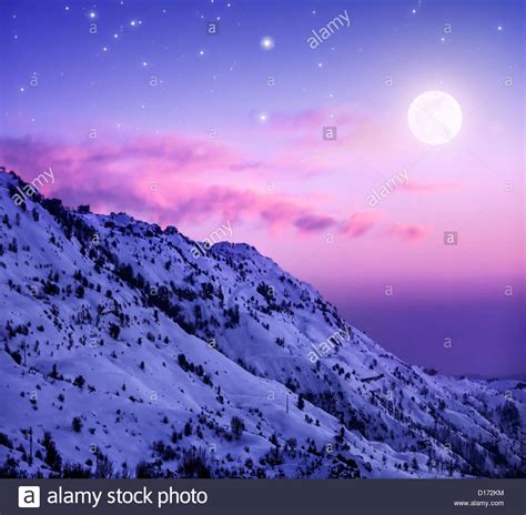 Photo Of Beautiful Snowy Mountains On Purple Sunset