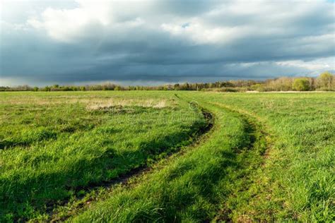 The Road Through The Pasture And The Cloudy Sky Stock Image Image Of
