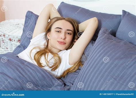 Beautiful Young Dreaming Girl Lying In Her Bed In The Morning With Closed Eyes Health And