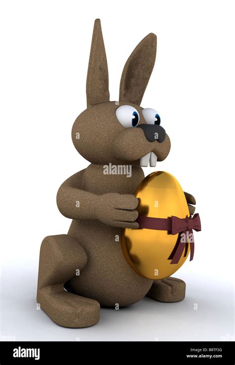 Easter Bunny Holding A Golden Egg Stock Photo Alamy
