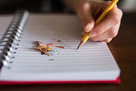 Writing Person Holding Pencil Writing On Notebook Notebook Image - Free Stock Photo
