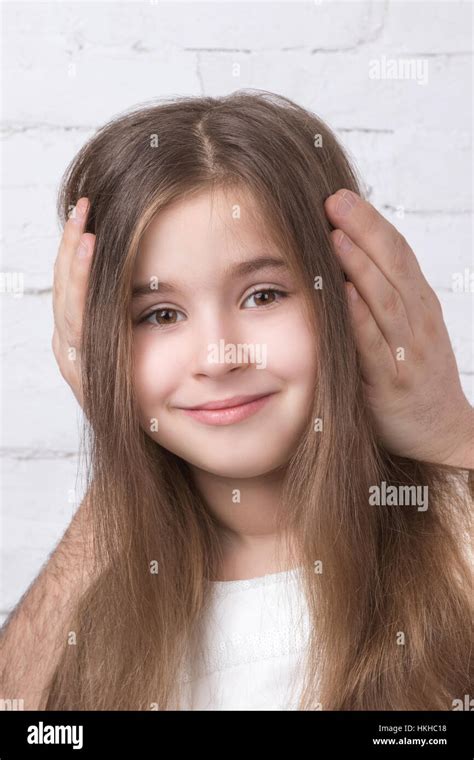 Girl With Closed Ears Stock Photo Alamy