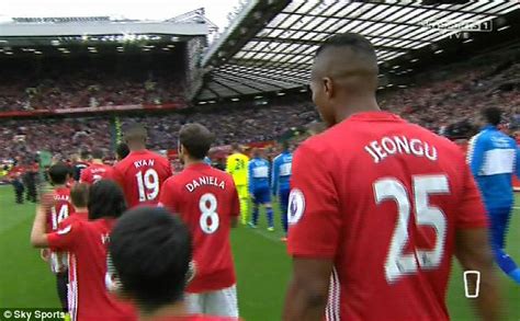 Manchester United Players Walk Out With Mascots Names On The Back Of