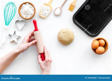Roll Out The Dough Dough Ball Near Roller Pin And Other Cookware On