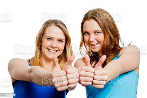 Two Pretty Teenage Girls Giving Thumbs Up Signal Of Approval 照片檔及更多 人