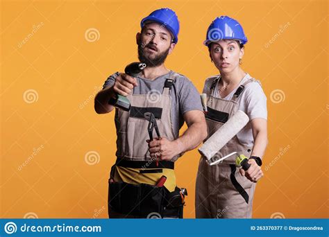 professional renovators showing construction tools stock image image of repairman woman