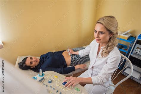 Ultrasound Test Pregnancy Gynecologist Checking Fetal Life With Scanner Stock 写真 Adobe Stock