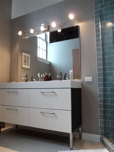 You don't want your vanity light to run past the edges of the mirror, and too small will not provide enough light. track lighting | Beautiful bathroom vanity, Unique ...