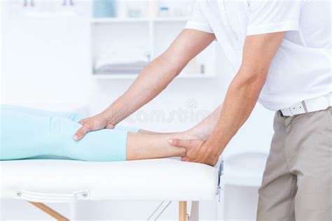 Physiotherapist Doing Leg Massage To His Patient Stock Image Image Of Clinic Physiotherapy