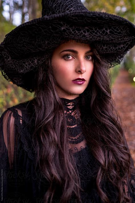 Beautiful Woman In Witch Costume Celebrating Halloween By Stocksy