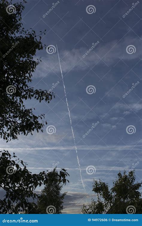 Traces Of Aircraft In The Evening Sky Stock Photo Image Of Cage