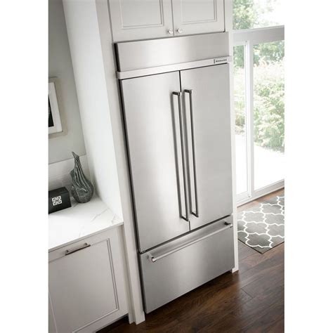 On the bottom of the unit's base, adjacent to the accessory holders. Kitchenaid Refrigerator | New Life Appliance Repair