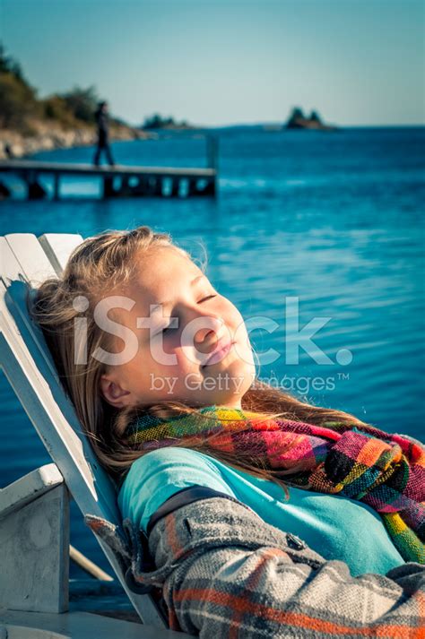 Teenage Girl Resting By The Ocean Stock Photo Royalty Free Freeimages