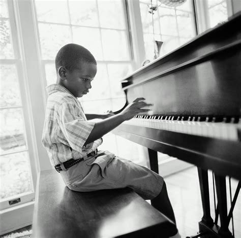 Boy 6 8 Playing Piano In Home Bandw Photograph By Tony Anderson